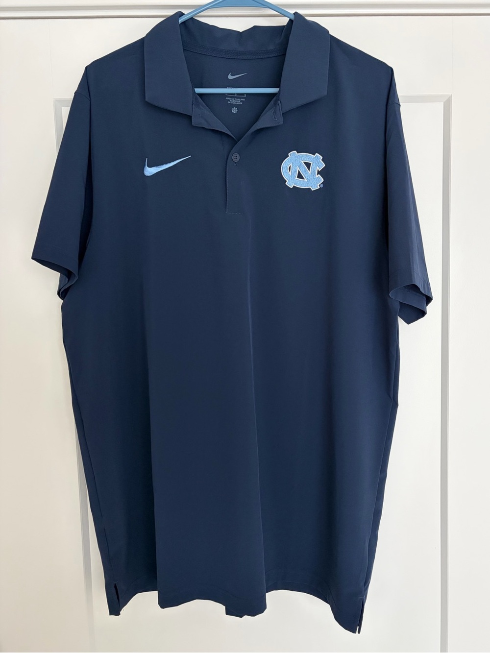 Nike Men's Navy Polo with UNC Carolina Blue Logo